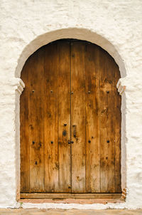 Closed wooden door of historic church