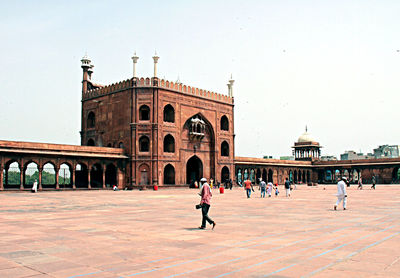 Group of people in front of historical building