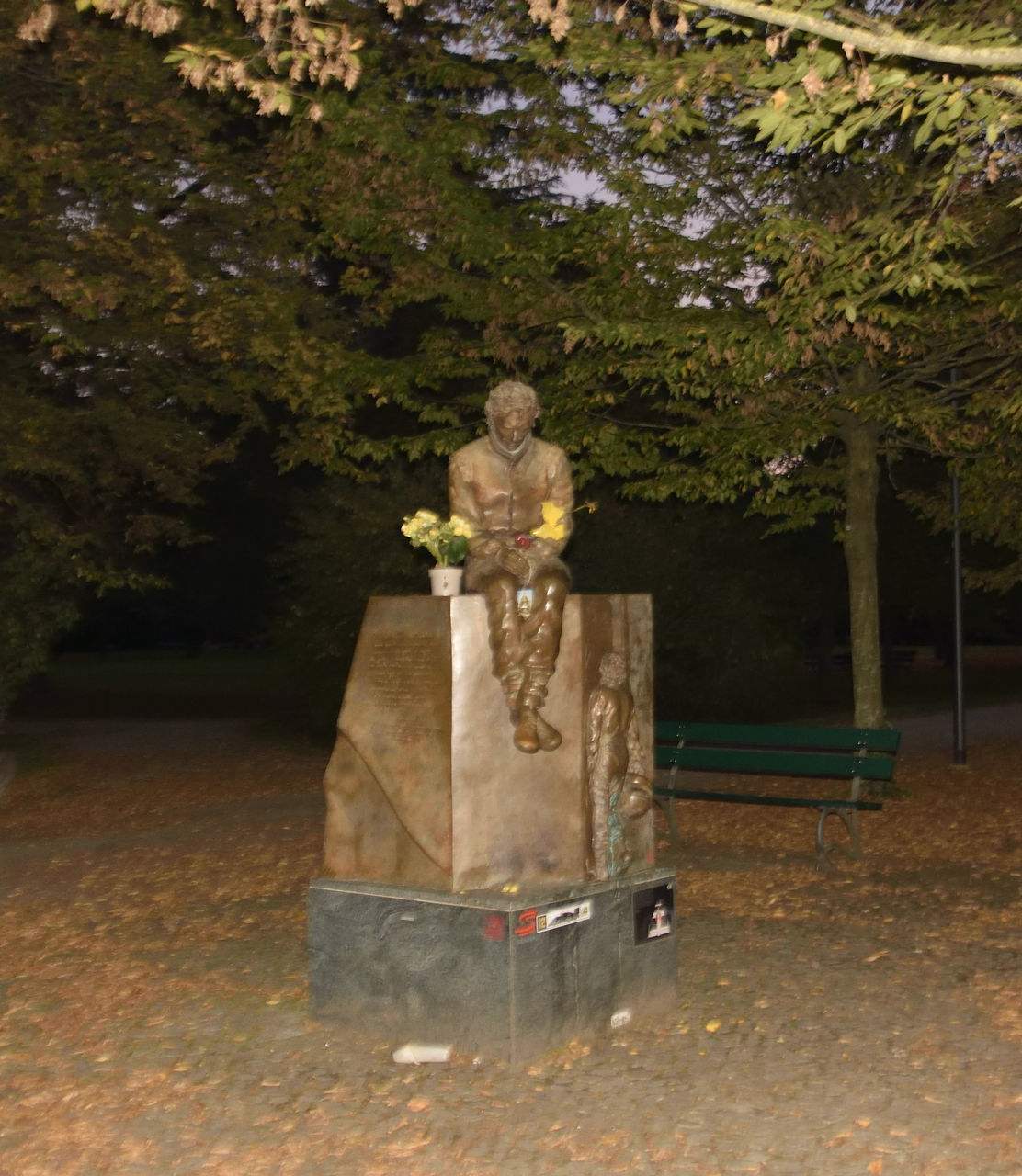 STATUE BY TREE IN PARK