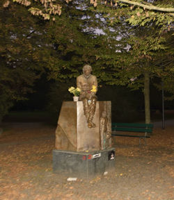 Statue against trees in park