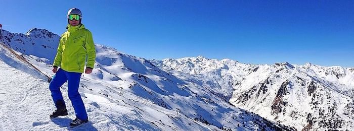 Tourists on snow covered mountain