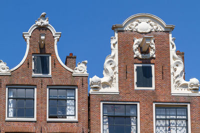 Low angle view of statue against building