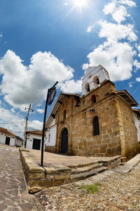 Low angle view of bell tower against sky