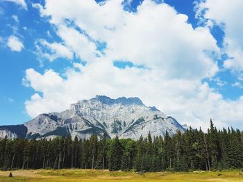 Scenic view of mountains against cloudy sky