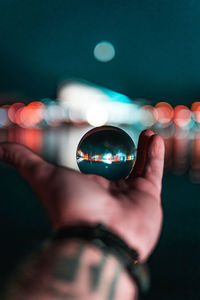 Close-up of hand holdinga sphere 