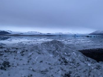 Scenic view of sea against sky during winter