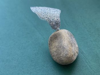 High angle view of pebble on table