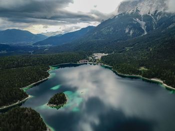 Scenic view of lake and mountains against sky