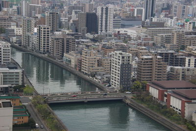 High angle view of river amidst buildings in city