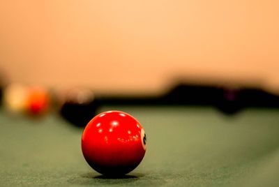 Close-up of red ball on pool table