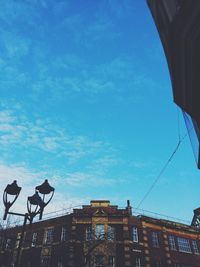 Low angle view of built structure against blue sky