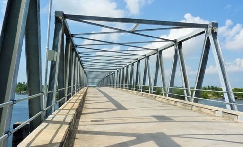 Modern bridge against cloudy sky