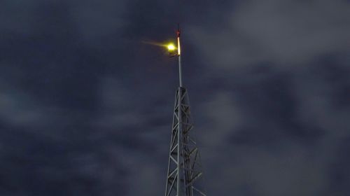 Low angle view of street light at night
