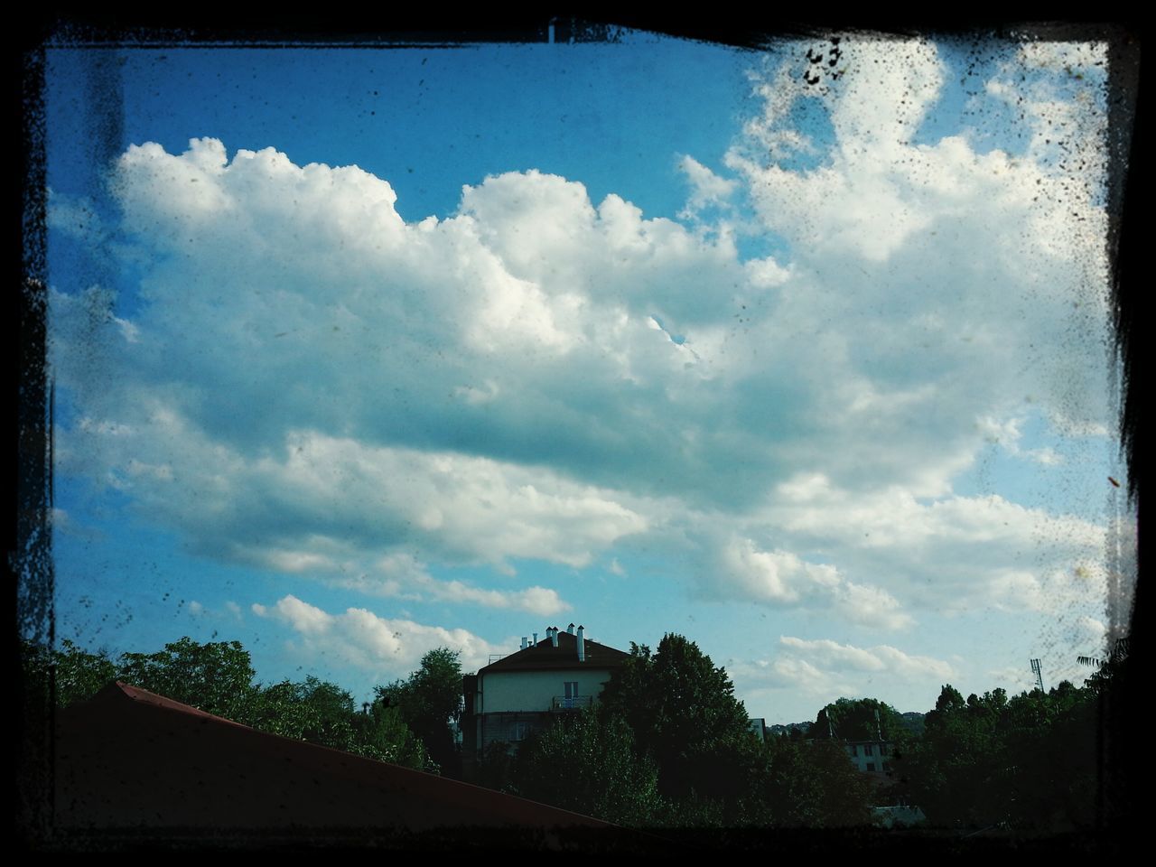 transfer print, sky, auto post production filter, cloud - sky, built structure, cloudy, architecture, building exterior, cloud, low angle view, house, tree, day, outdoors, no people, nature, roof, overcast, weather, dusk