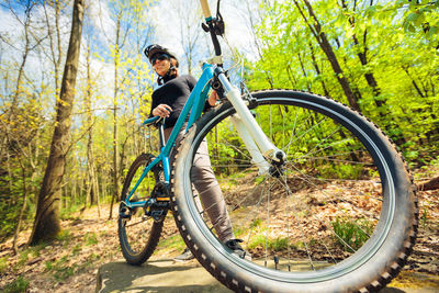 Man riding bicycle in park