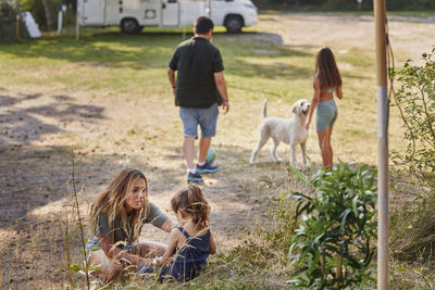 Family relaxing at camping site