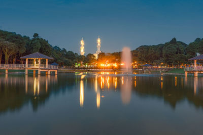 Reflection of illuminated buildings in water