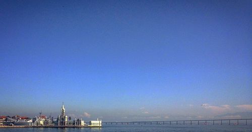 View of bridge against clear blue sky