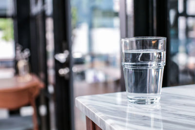 Close-up of water in glass on table