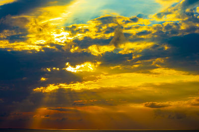 Low angle view of dramatic sky during sunset