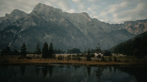 Scenic view of lake and mountains against sky