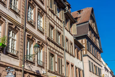 Low angle view of buildings against clear sky