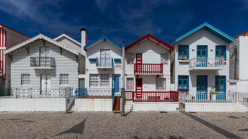 Residential houses against sky in city