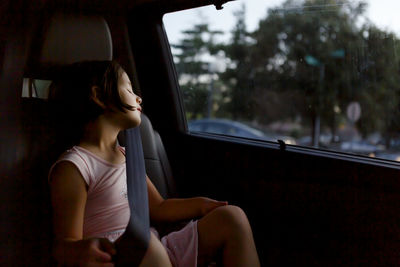 Woman sitting in car