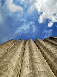 Low angle view of building against cloudy sky