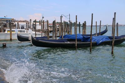 Boats moored in canal