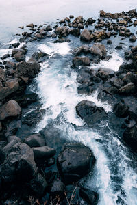 Scenic view of rocks at sea shore