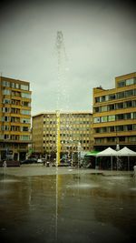 Modern buildings against sky in city