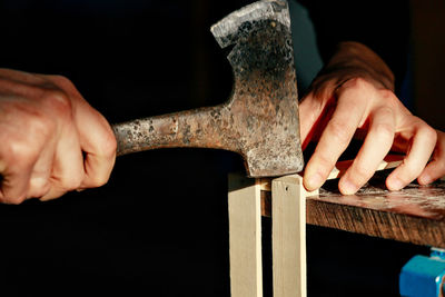 Cropped hands of man working in workshop