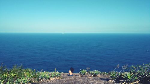 Scenic view of sea against clear blue sky