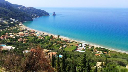 High angle view of beach by sea against sky