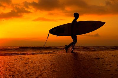 Silhouette of man standing on beach