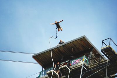 Low angle view of bungee jumping