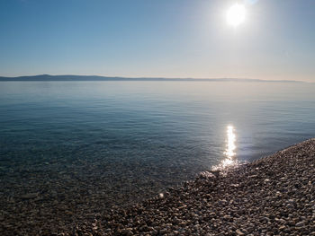 Scenic view of sea against sky at sunset