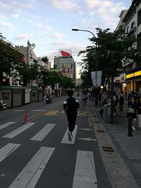 People walking on road in city