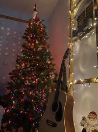 Low angle view of illuminated christmas tree