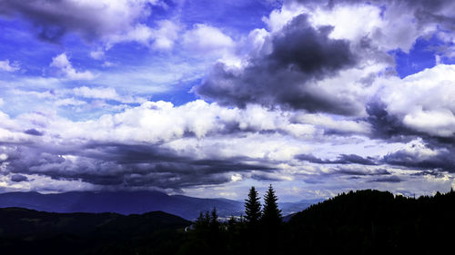 Scenic view of silhouette mountains against sky