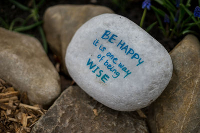 Close-up of text on stone wall