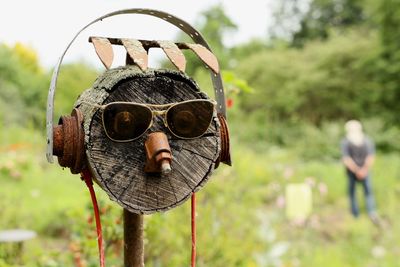 Garden sculpture of man wearing sunglasses