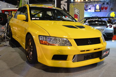 Yellow car parked on road