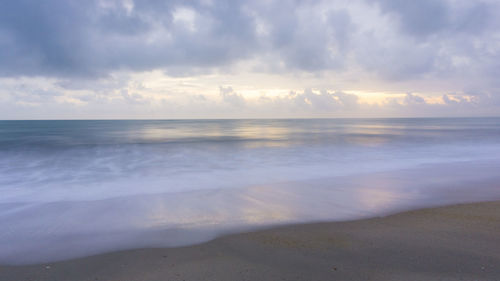 Scenic view of sea against sky at sunset