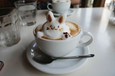 Close-up of coffee cup on table