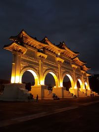 Illuminated historic building against sky at night