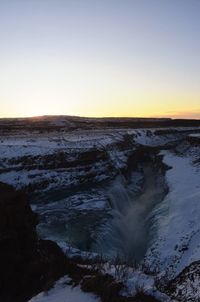 Scenic view of sea against clear sky during sunset