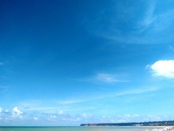 Scenic view of sea against blue sky