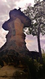 Low angle view of rock formation against sky